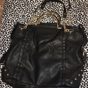 Large black leather purse with gold ascents